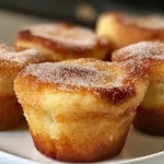 Close-up of golden cinnamon sugar French toast muffins, highlighting their soft texture and sugar-coated tops. Perfect for breakfast or brunch.